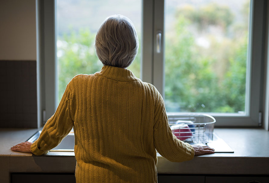woman looking out window