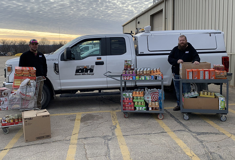 Dubuque team with food for pantry