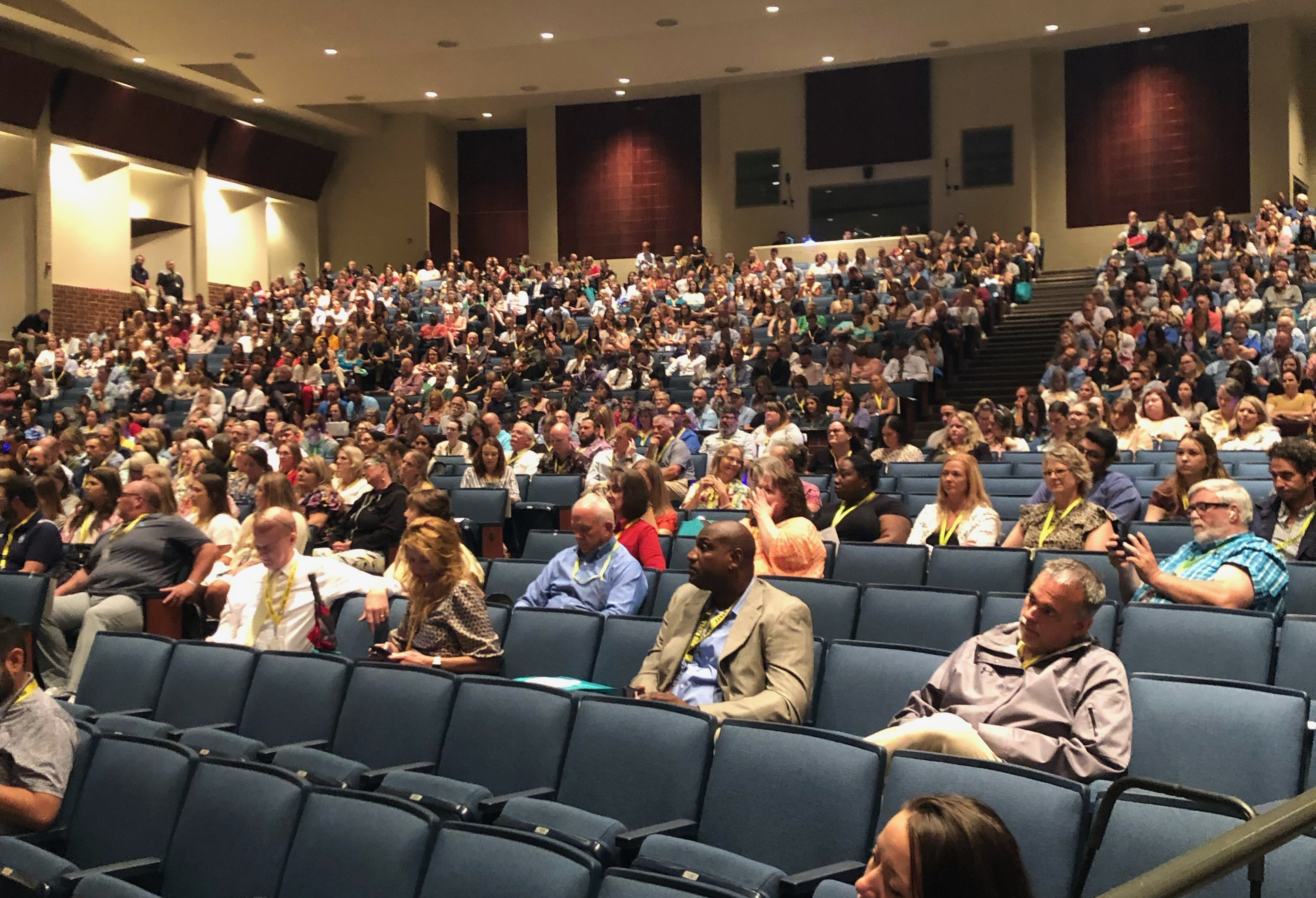 group of people in auditorium