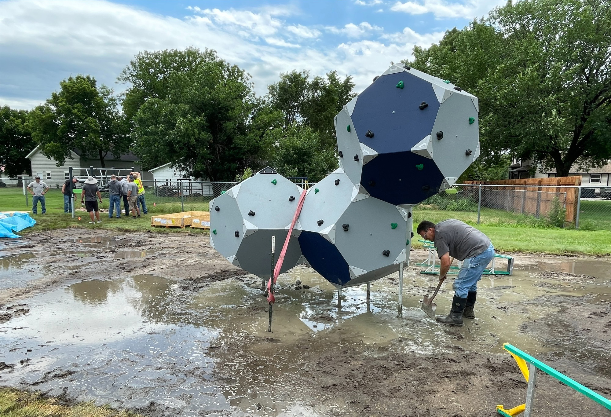 crews installing playground equipment