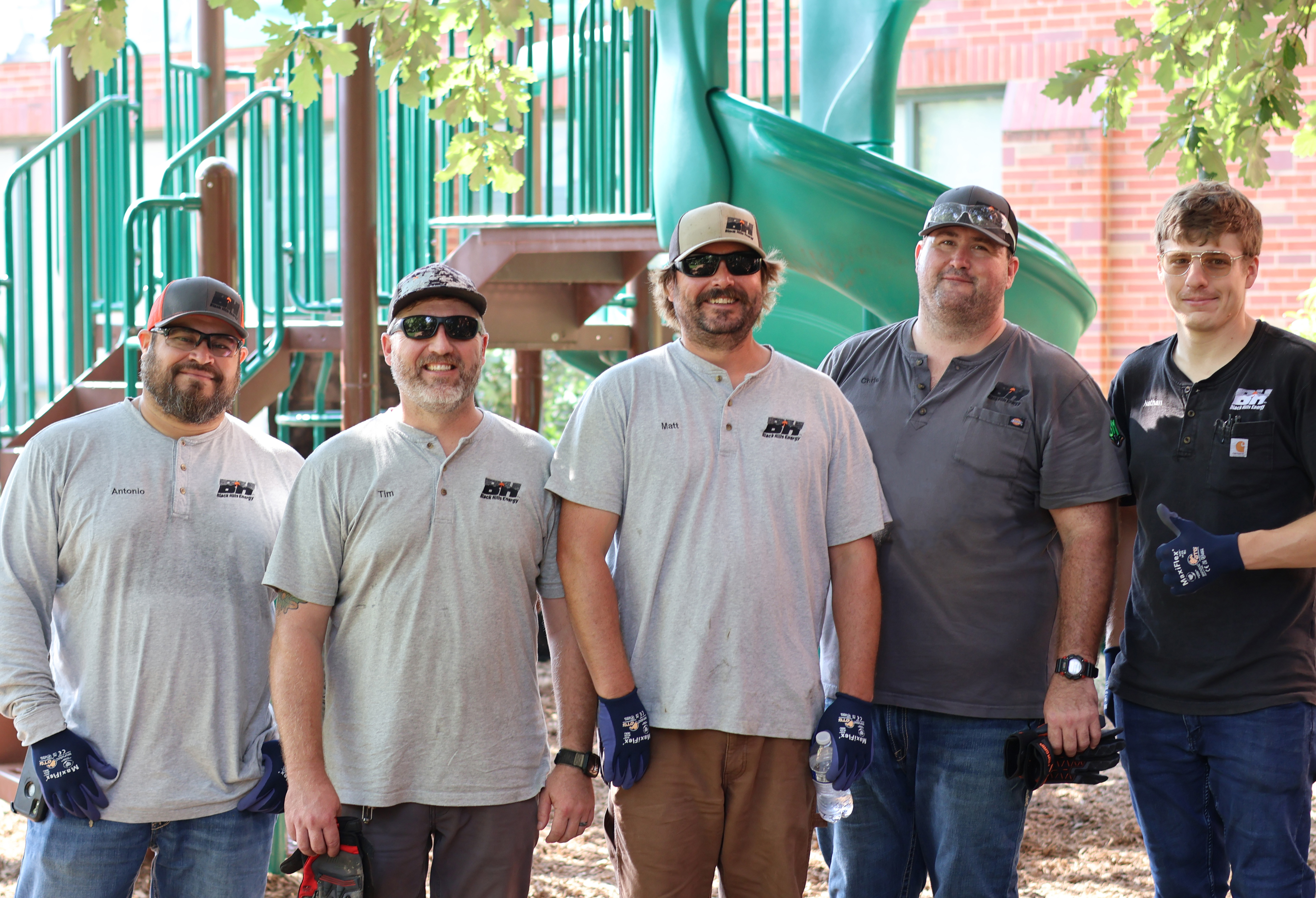 group of men in front of playground