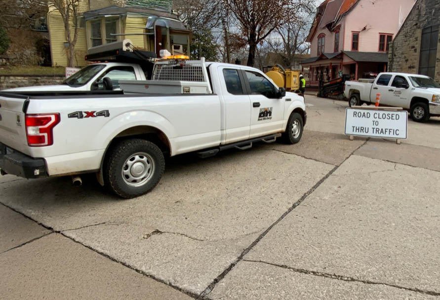 Black Hills Energy service trucks in a residential construction site 