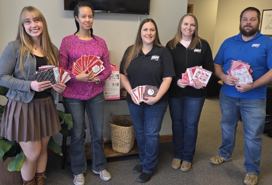 Black Hills Energy employees delivering valentines to seniors