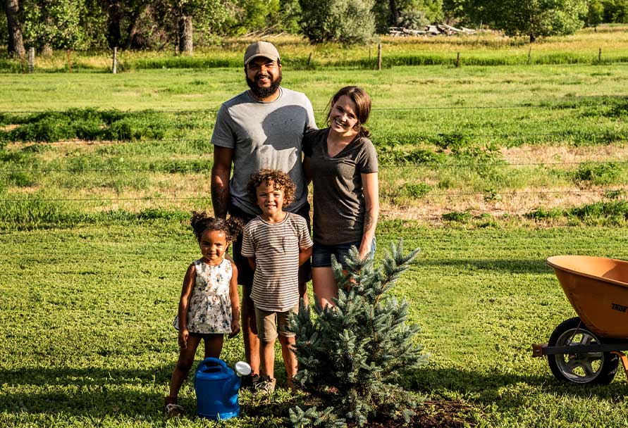 family planting tree
