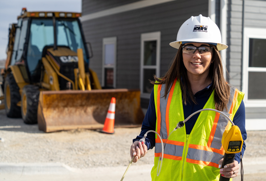 Woman in hardhat with construction