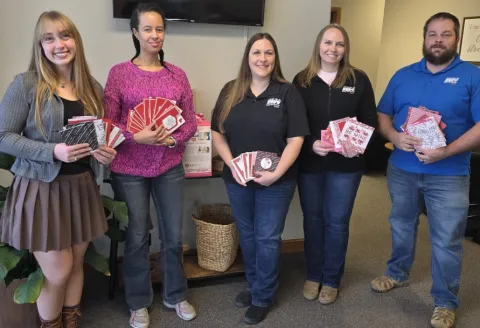 Black Hills Energy employees delivering valentines to seniors