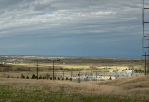 View of a substation in South Dakota with prairie and blue sky